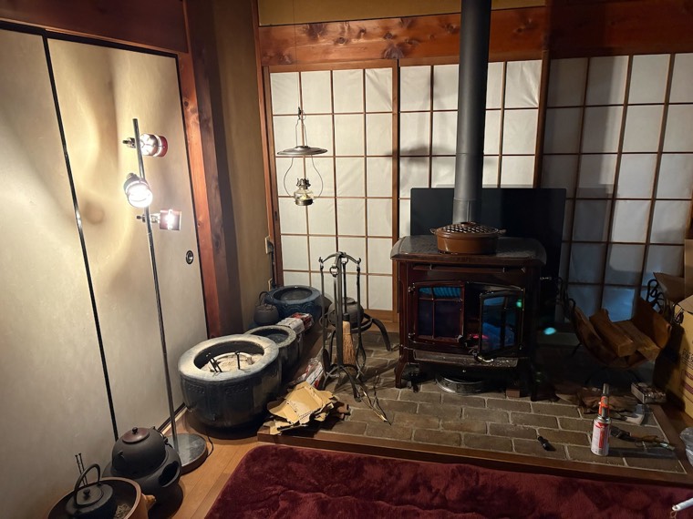 The stove lit on a winter evening